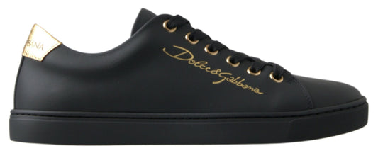 Black sneaker with gold laces and logo on side