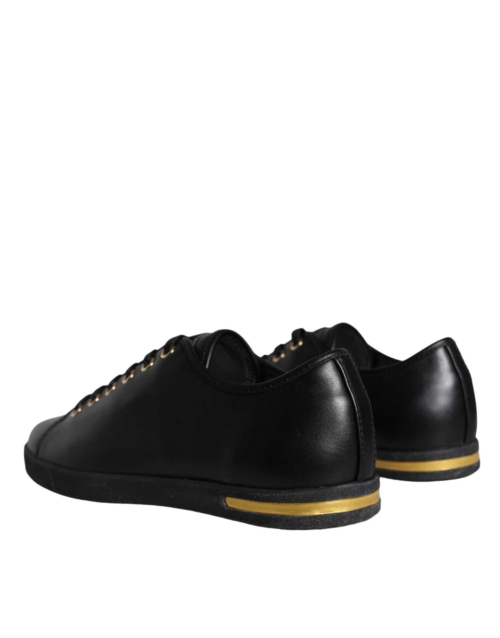 Pair of black shoes with yellow stripes and laces