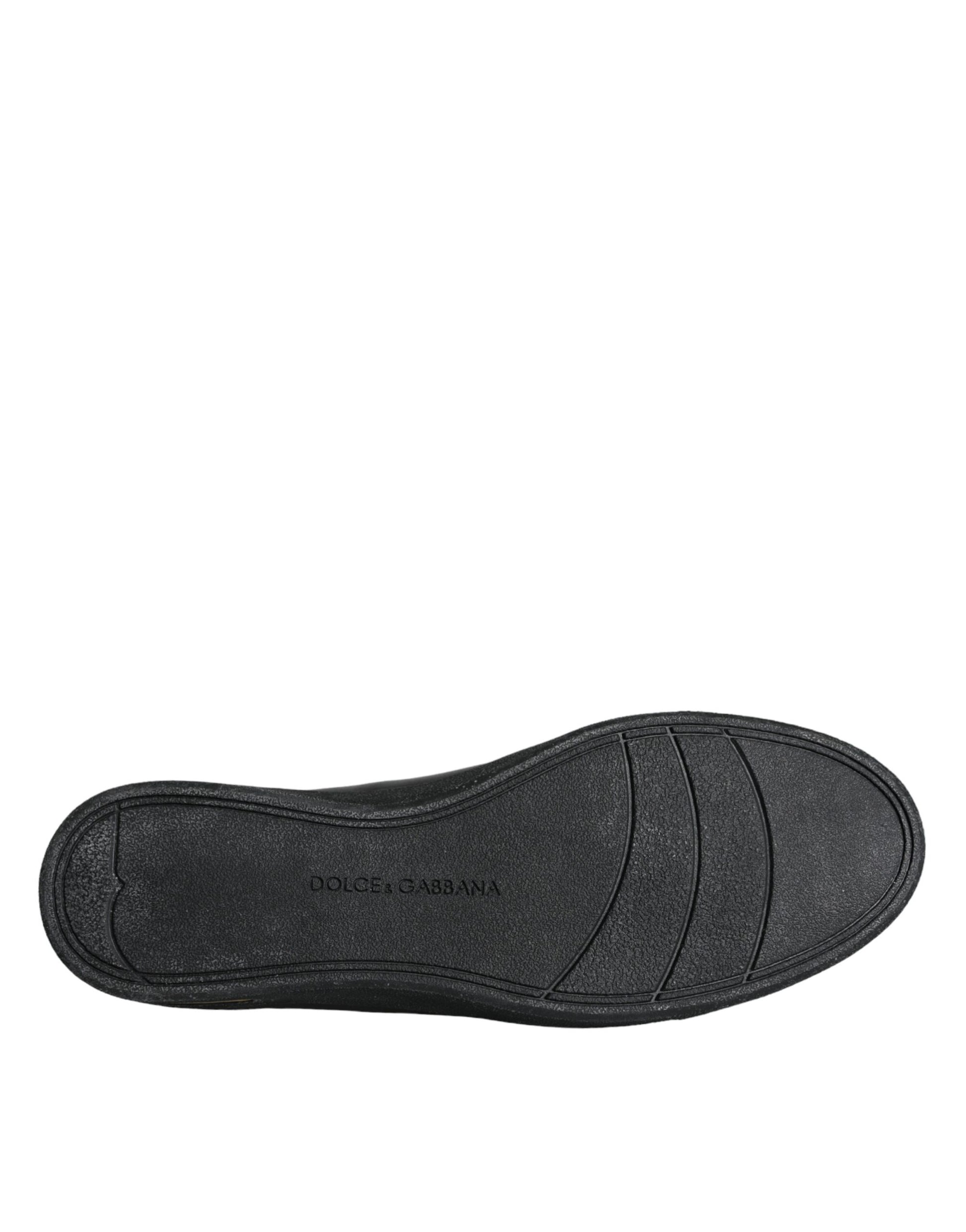 Black shoe with laces and a logo on the side