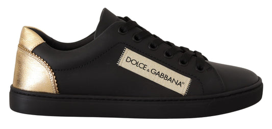 Black and gold sneaker with white laces and a logo on the side