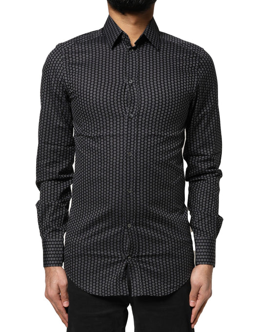 A black dress shirt with a gold pattern, designed by Dolce & Gabbana