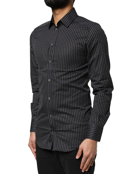A black dress shirt with a gold pattern, featuring long sleeves and a collar
