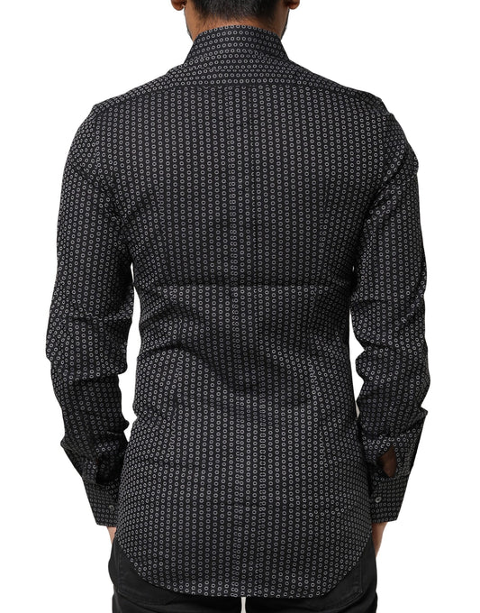 A black dress shirt with a gold pattern, featuring a collar and long sleeves