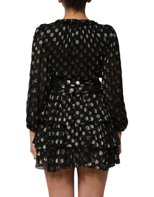 A black dress with gold polka dots and a brocade pattern, featuring a belted waist