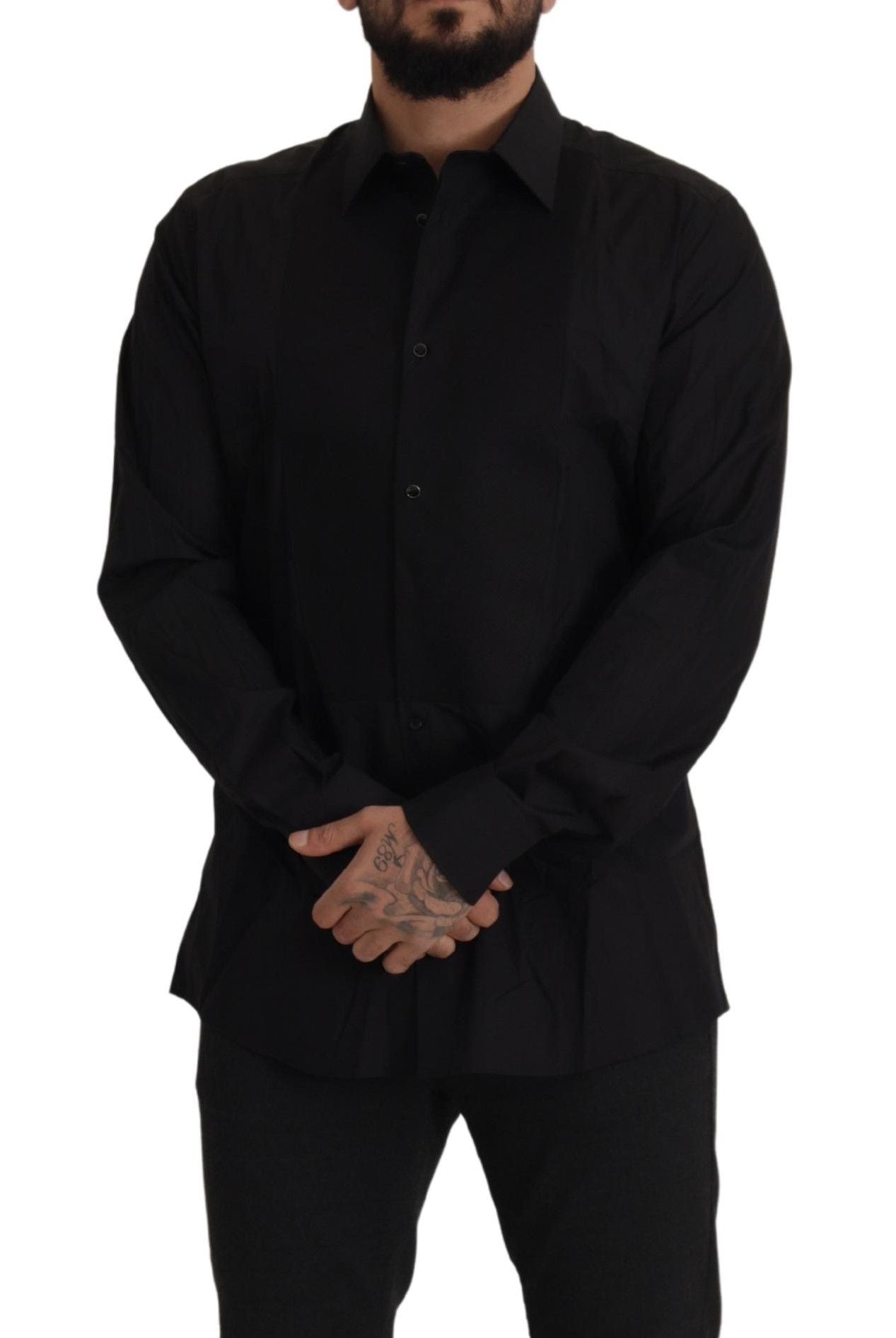 A black tuxedo dress shirt with gold accents, designed by Dolce & Gabbana. It is a slim fit style and appears