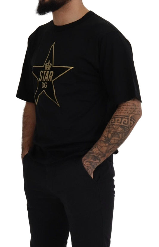 Man wearing black t-shirt with gold star logo