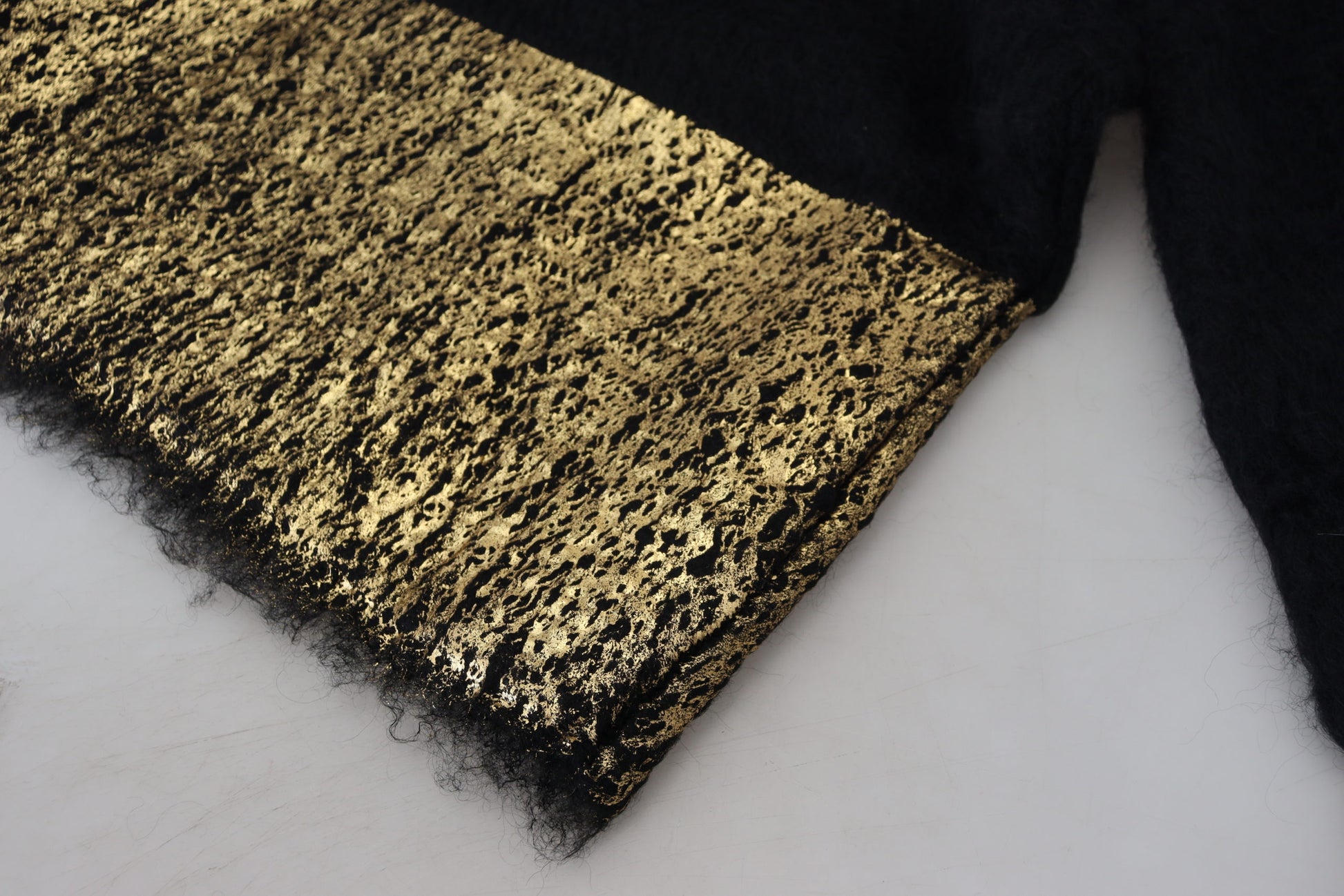 Textured fabric with gold glittery particles