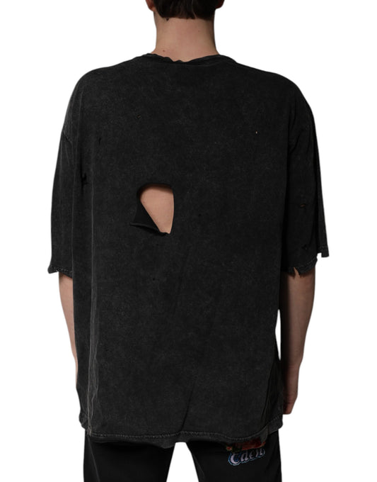 Mannequin torso wearing oversized black shirt with hole in back