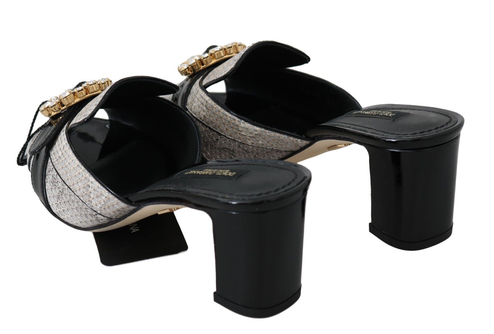 Pair of high heel shoes with straps and embellishments