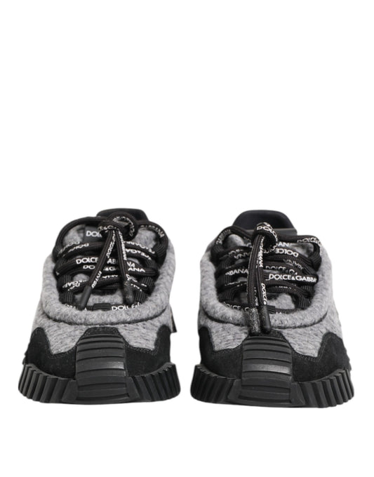 Pair of black and grey sneakers with white laces