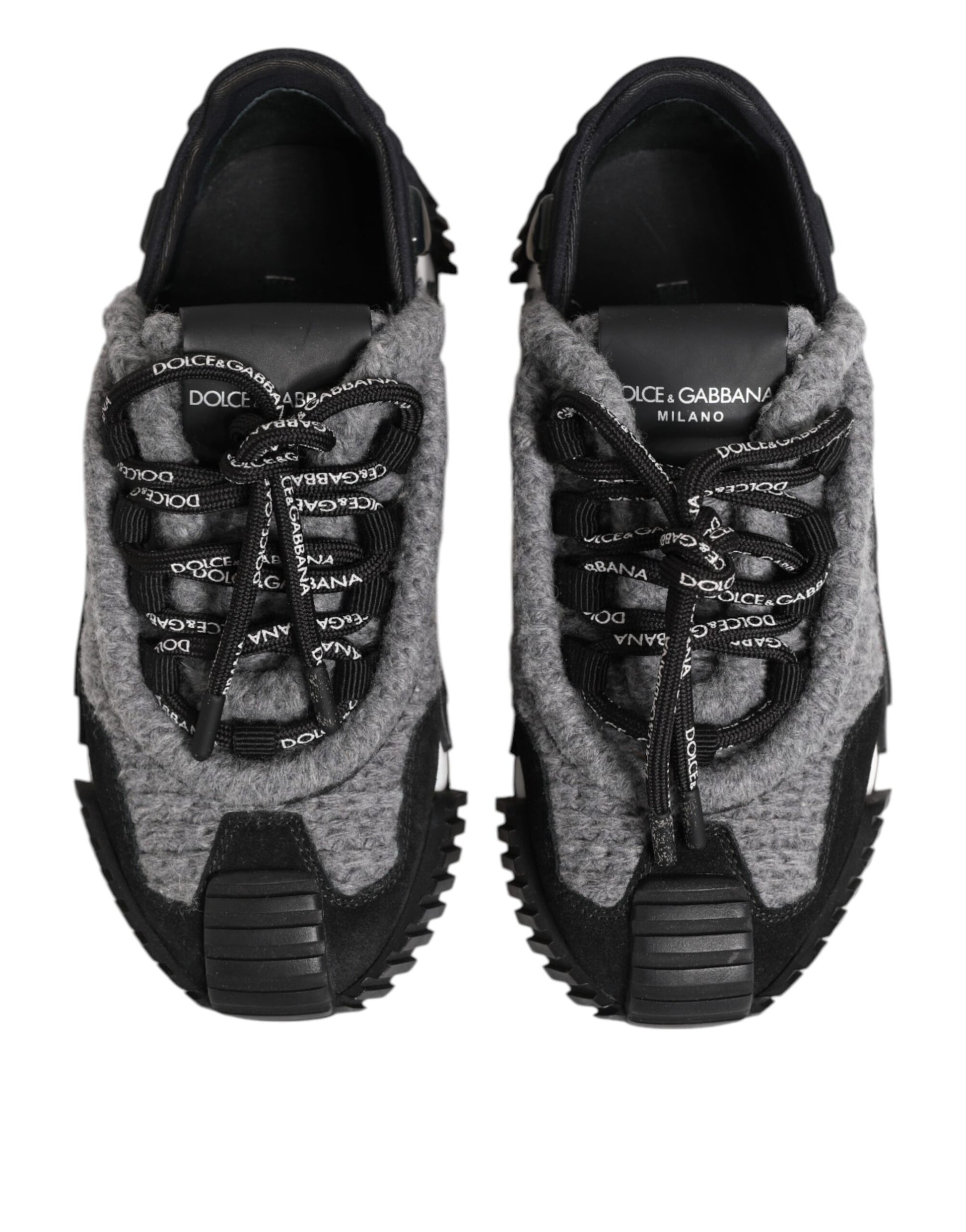 Pair of gray sneakers with black laces and soles