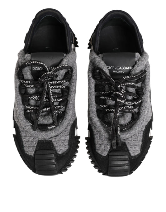 Pair of gray sneakers with black laces and soles