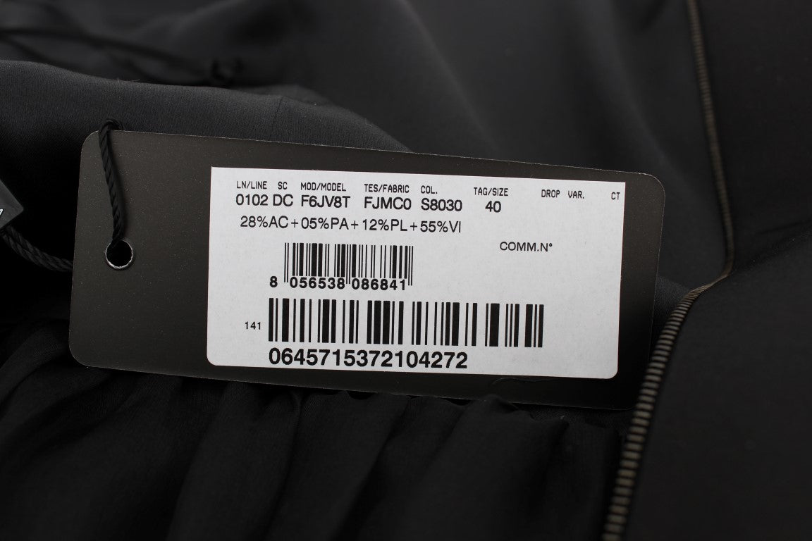 White tag on black fabric with barcode and text