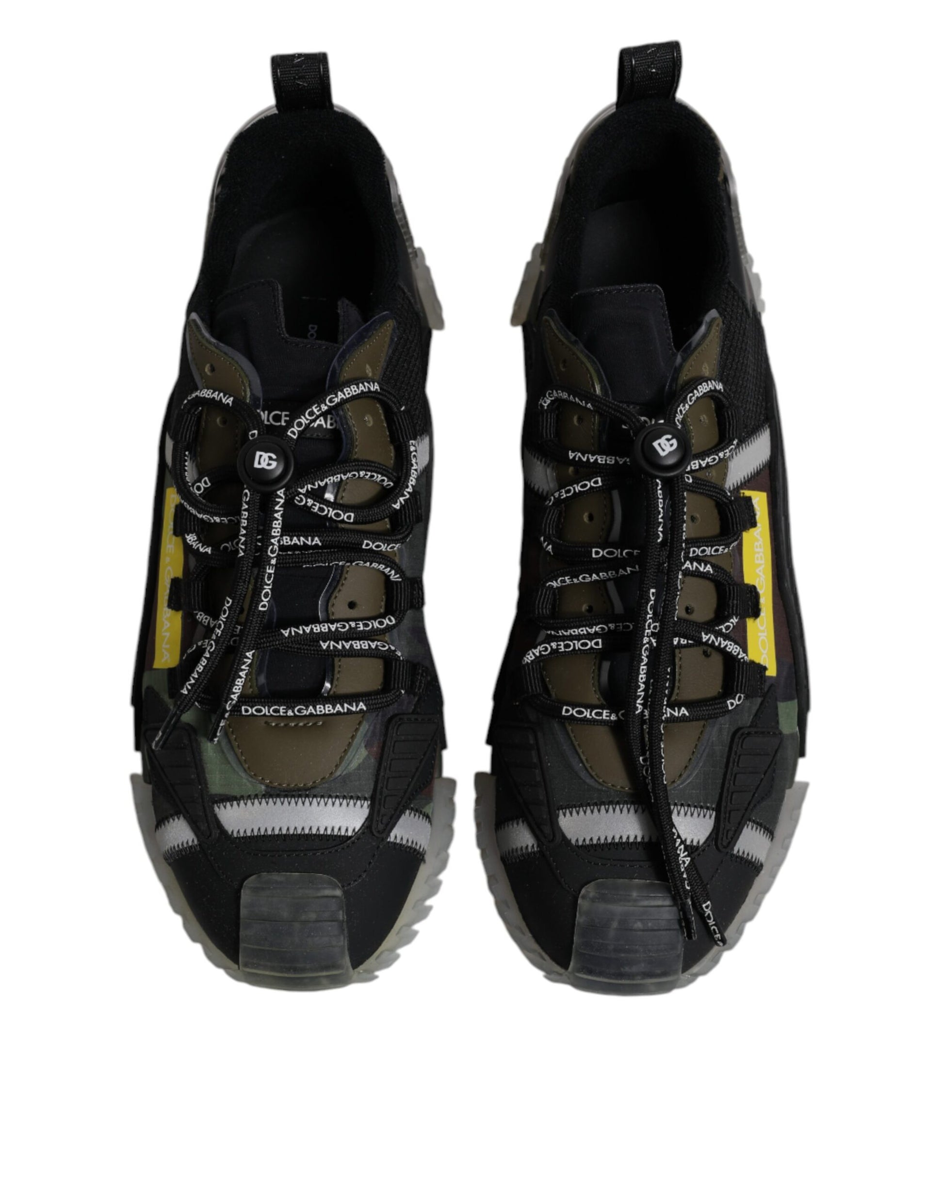 Pair of black sneakers with white laces and yellow accents