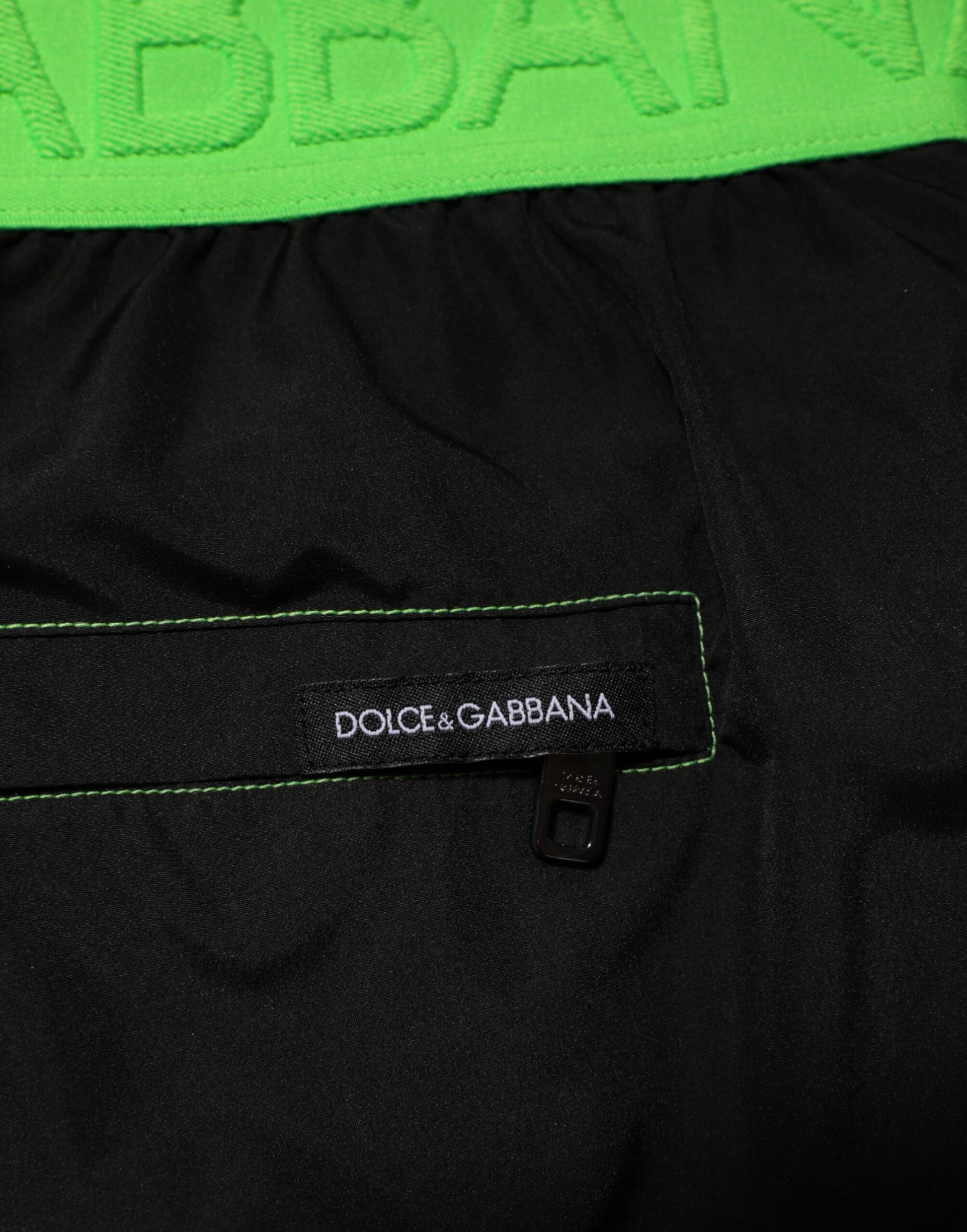 Black pants with green label on waistband
