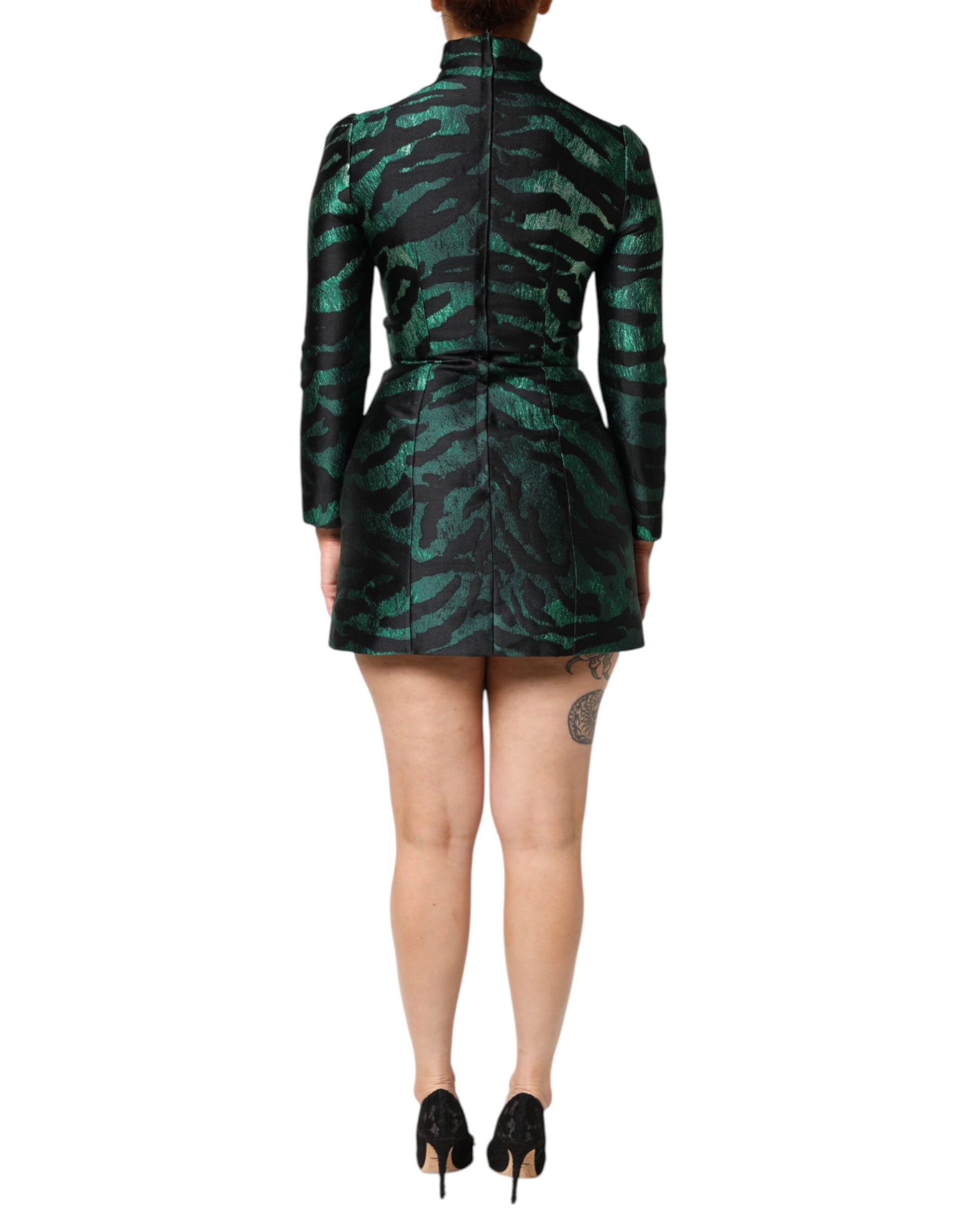A black, green, and metallic jacquard mini long dress with a high neckline