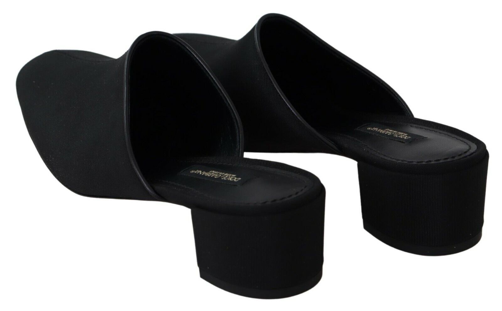 Pair of black high heel shoes with open toes and ankle straps