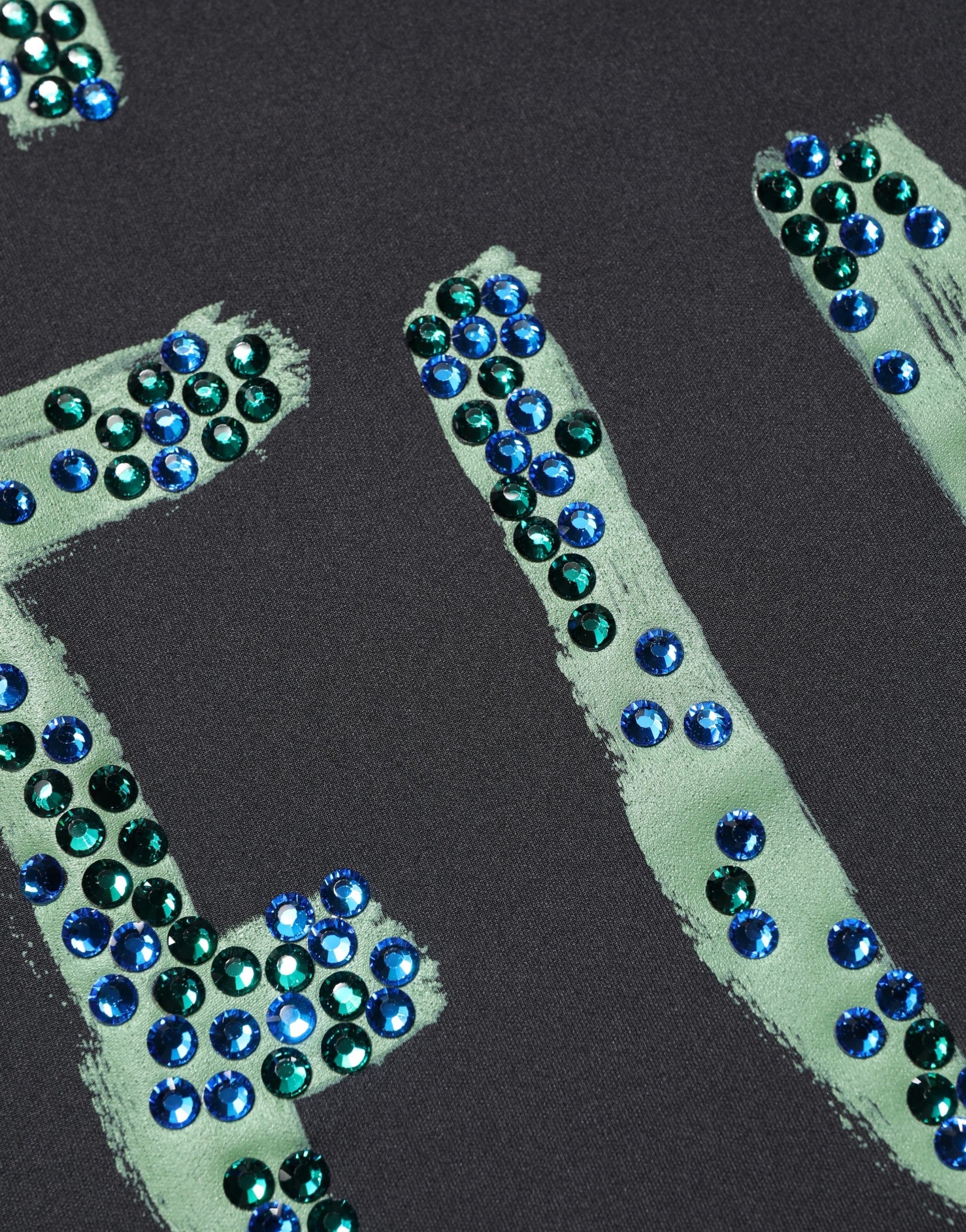 Blue sequins on black fabric
