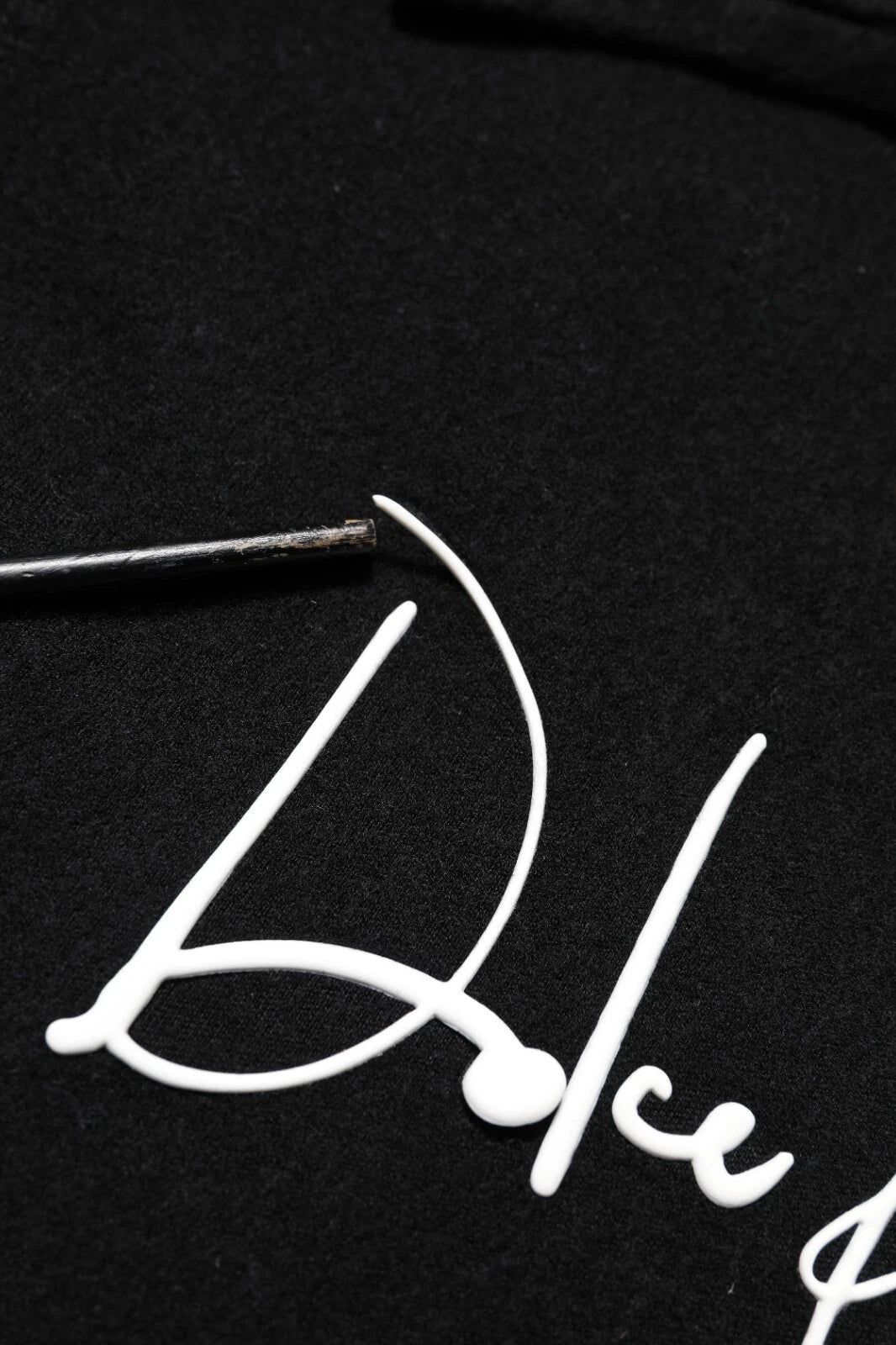 Black hoodie with white lettering