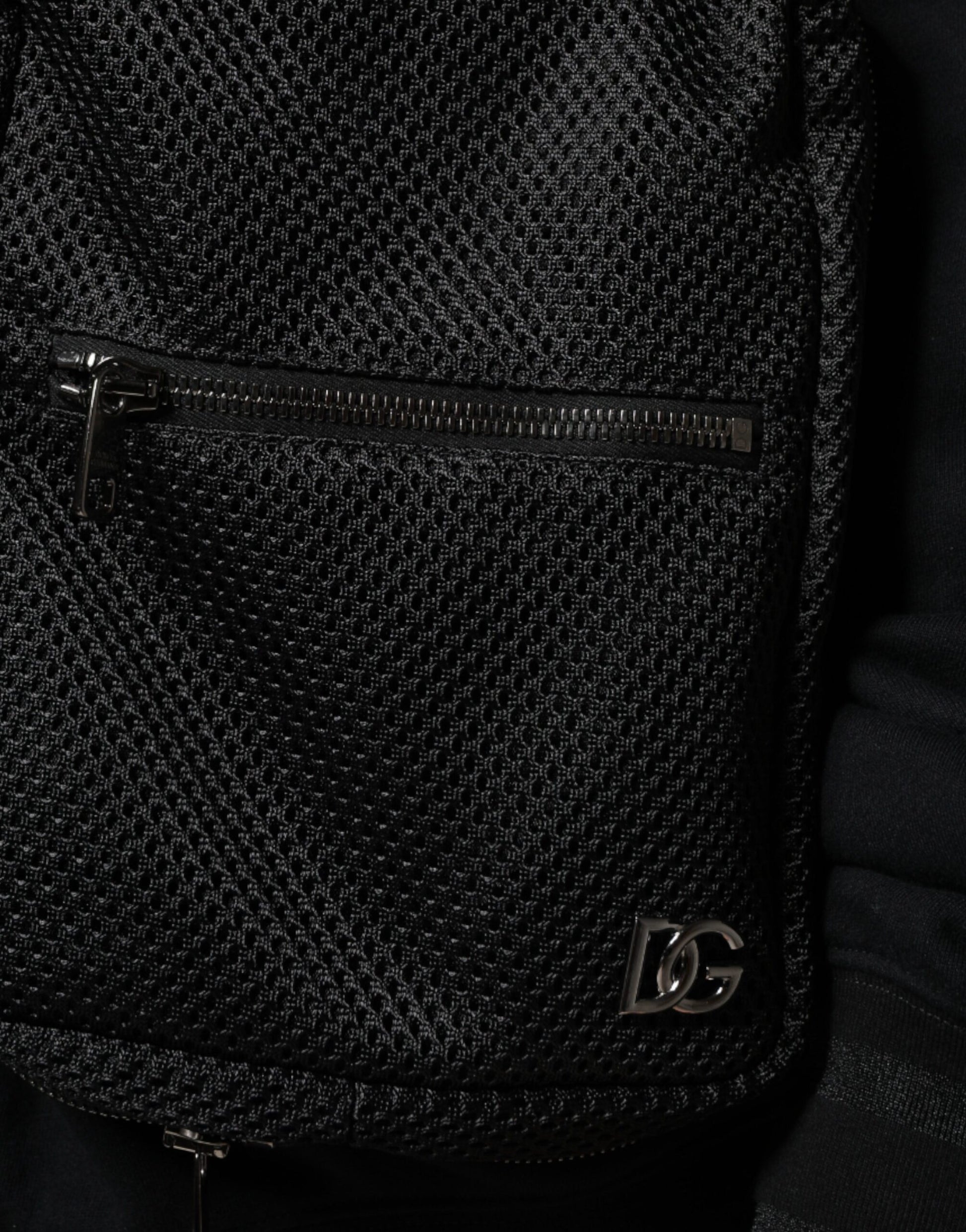 Black backpack with zippered pocket on front