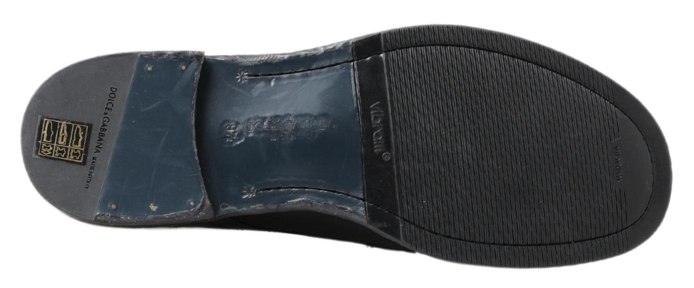 Pair of black and blue shoes with a checkered pattern on the soles