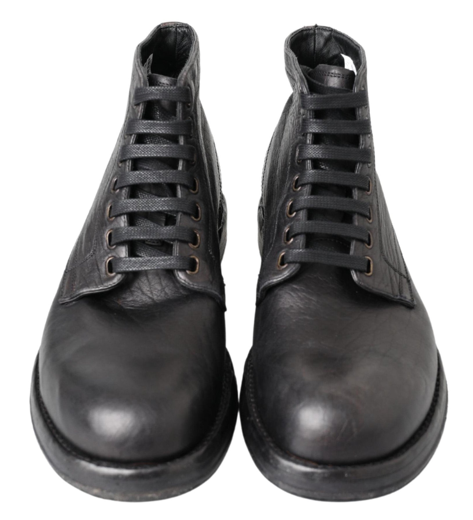 Pair of black leather boots with laces and stitching details