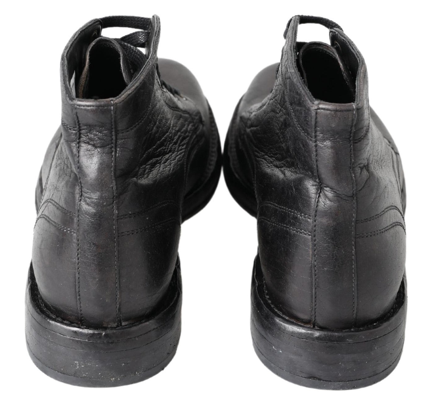 Pair of black leather shoes with laces and soles