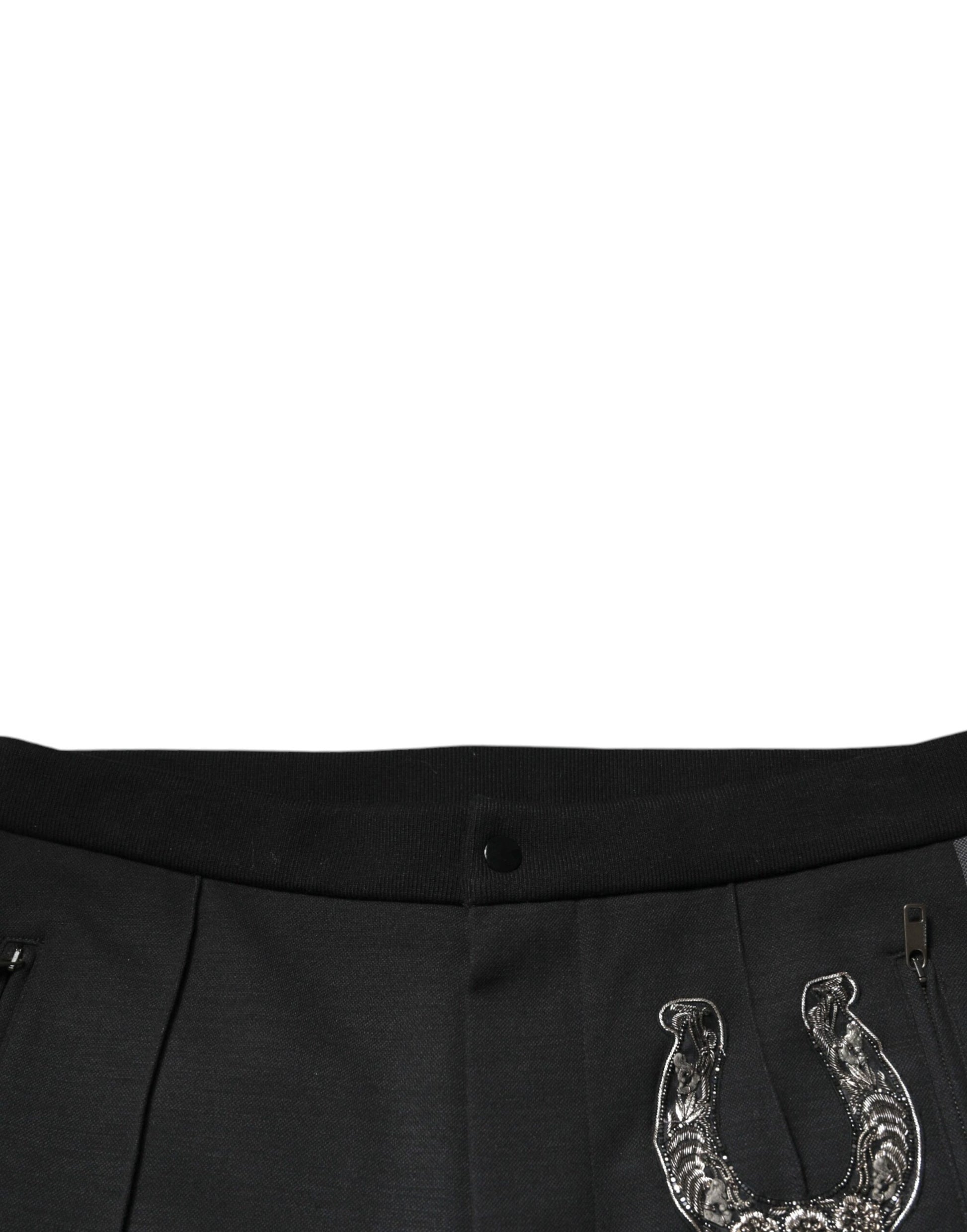Black pants with white horse shoe design on waistband