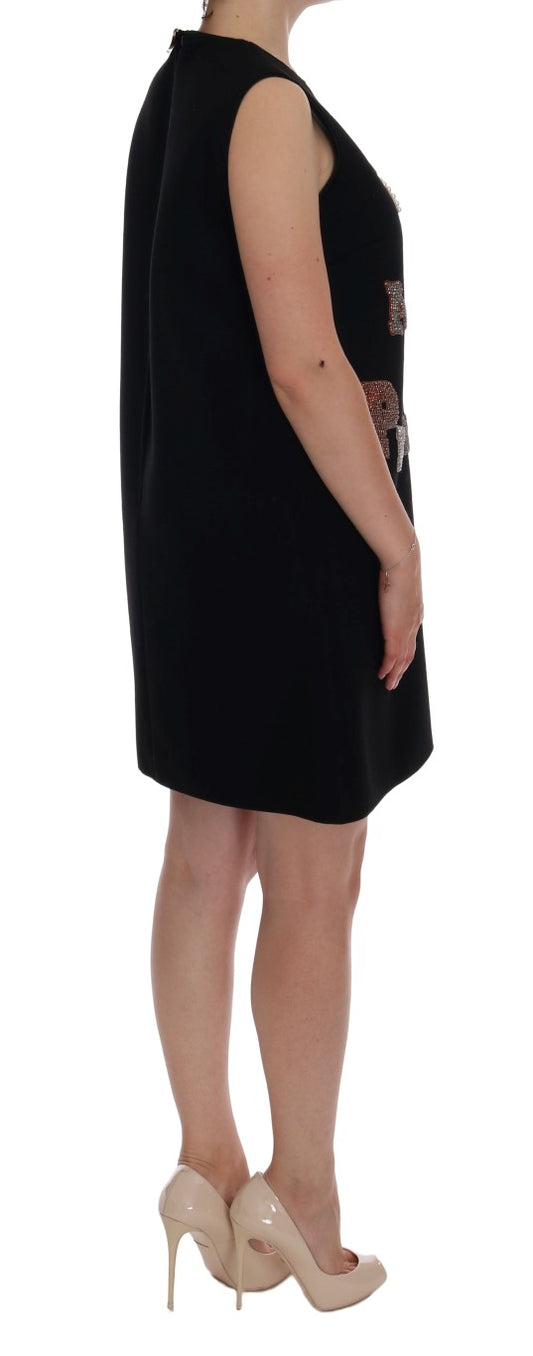 Woman wearing black dress and heels