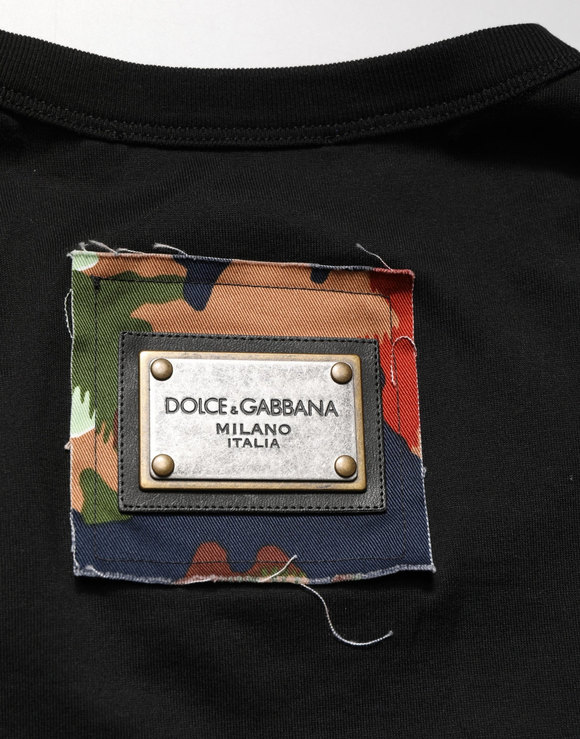 Black t-shirt with a patch on the front