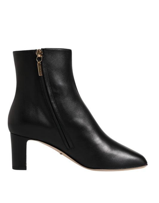 Black leather boot with gold zipper pull