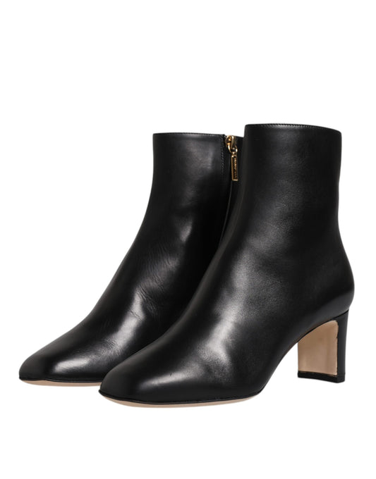 Pair of black leather boots with heels