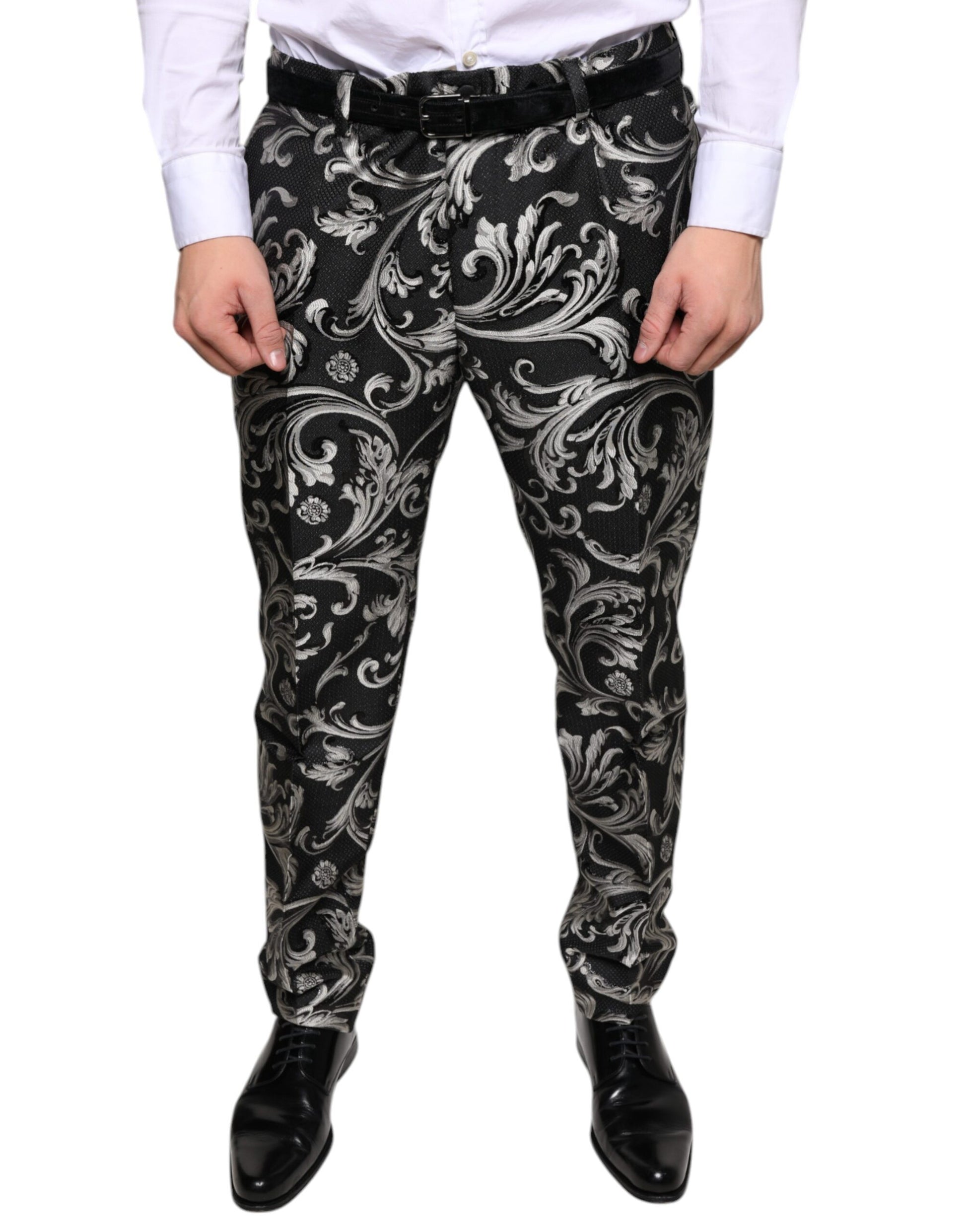 A pair of black jacquard skinny dress pants with a floral pattern