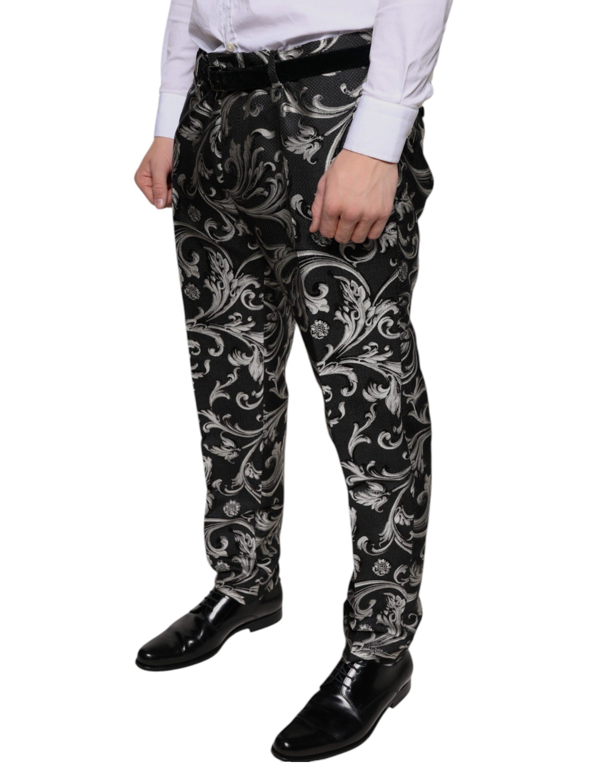 A pair of black jacquard skinny dress pants with a floral pattern