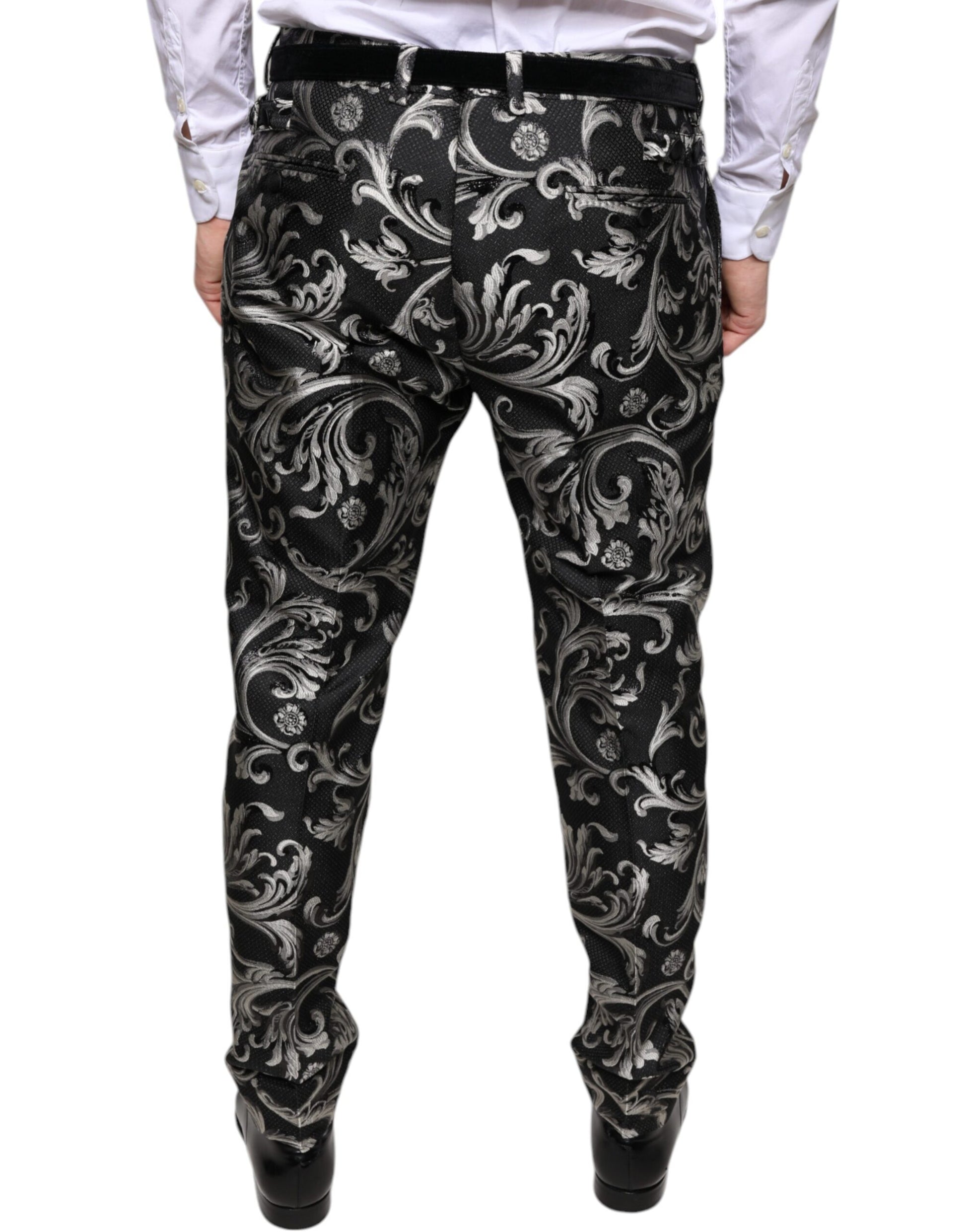 A pair of black jacquard skinny dress pants with a floral pattern