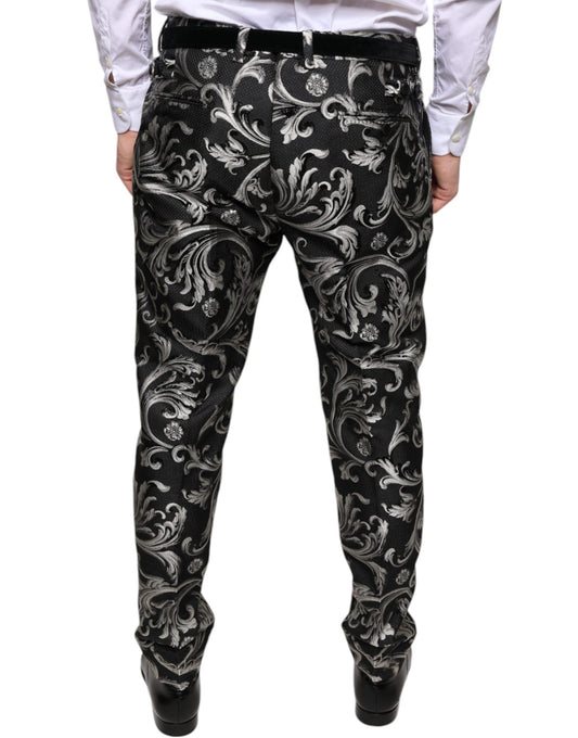 A pair of black jacquard skinny dress pants with a floral pattern