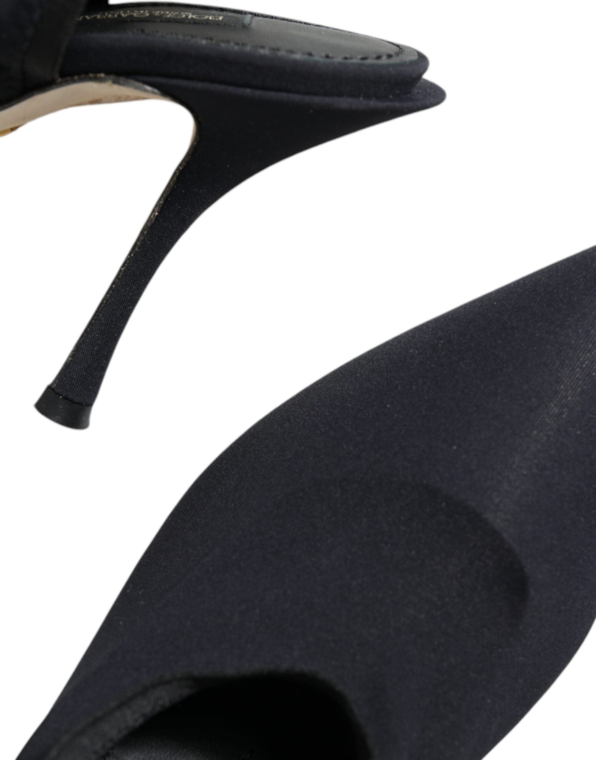 Pair of black high heel shoes with pointed toe