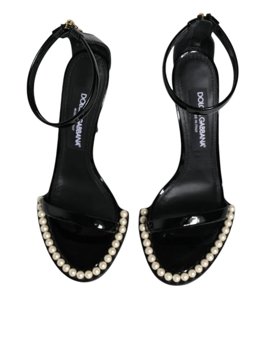 Black high heel shoes with pearl embellishments on straps