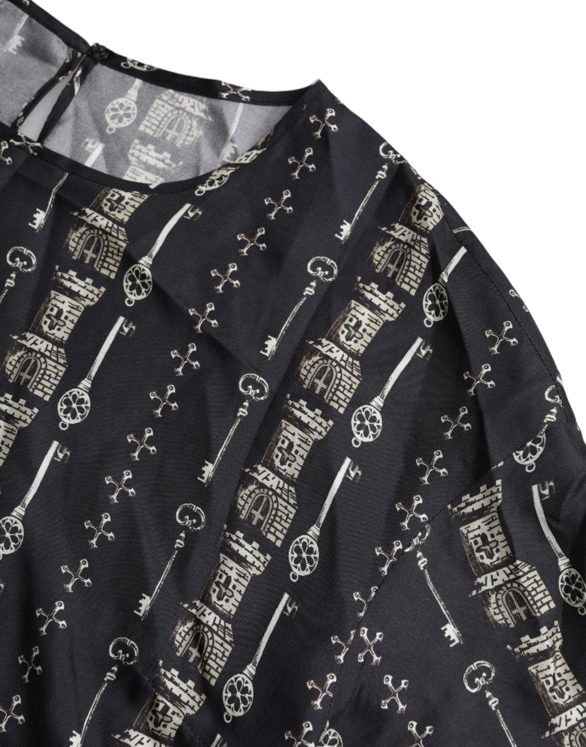Black shirt with gold embroidery on neckline