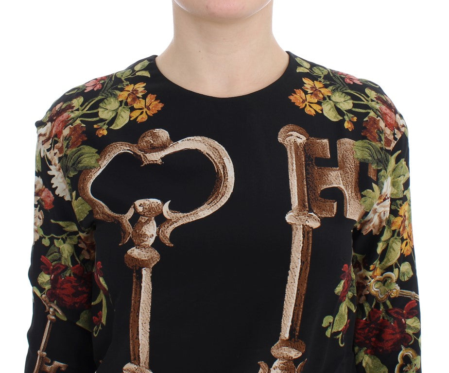 Black sweater with floral pattern and key embroidery on front