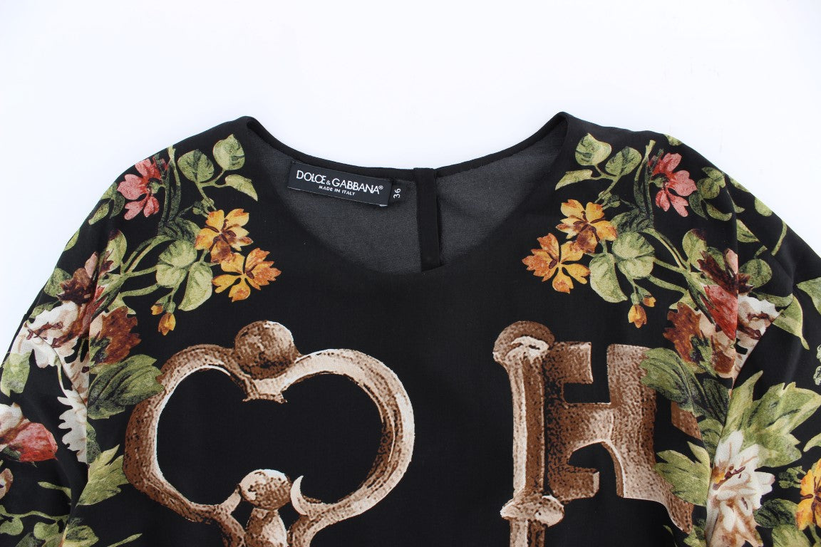 Black floral print top with gold lettering