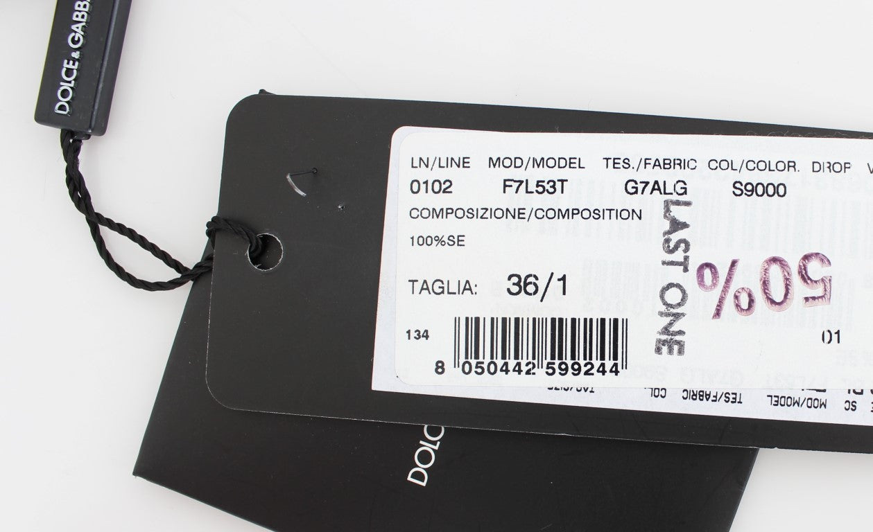 Tag on black clothing item with white text indicating size, price, and composition