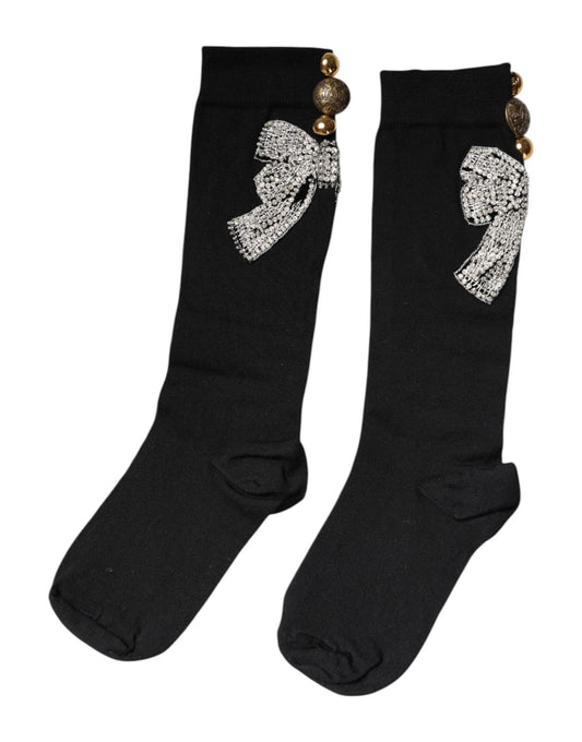 Pair of black socks with bow embellishments