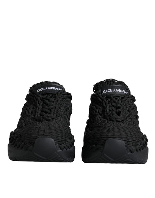 Pair of black high top sneakers with white logo on side