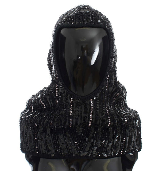 Black hooded garment with sequins on mannequin