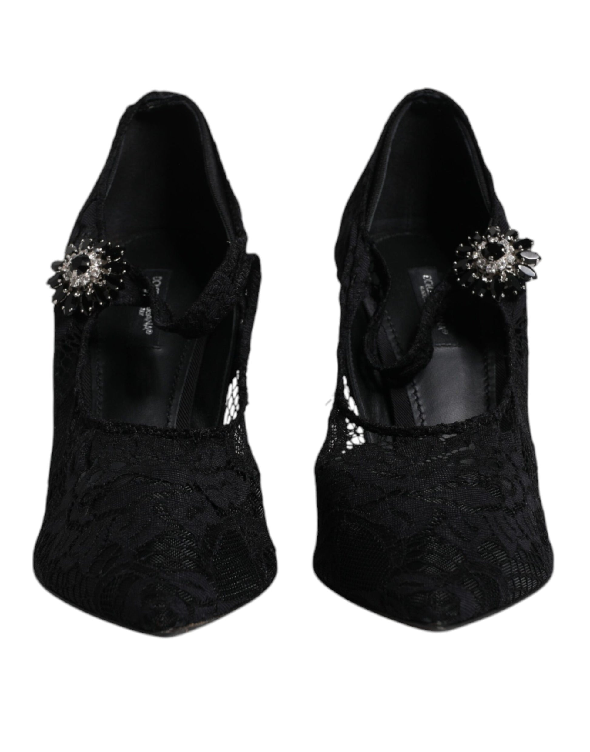 Pair of black high heel shoes with embellishments on top