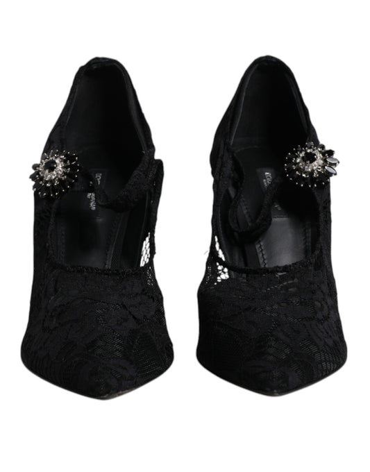 Pair of black high heel shoes with embellishments on top