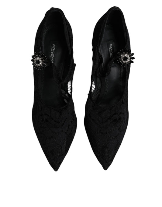 Pair of black high heel shoes with embellishments on top