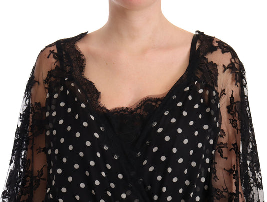A black lace dress with floral polka dots and a sheer overlay