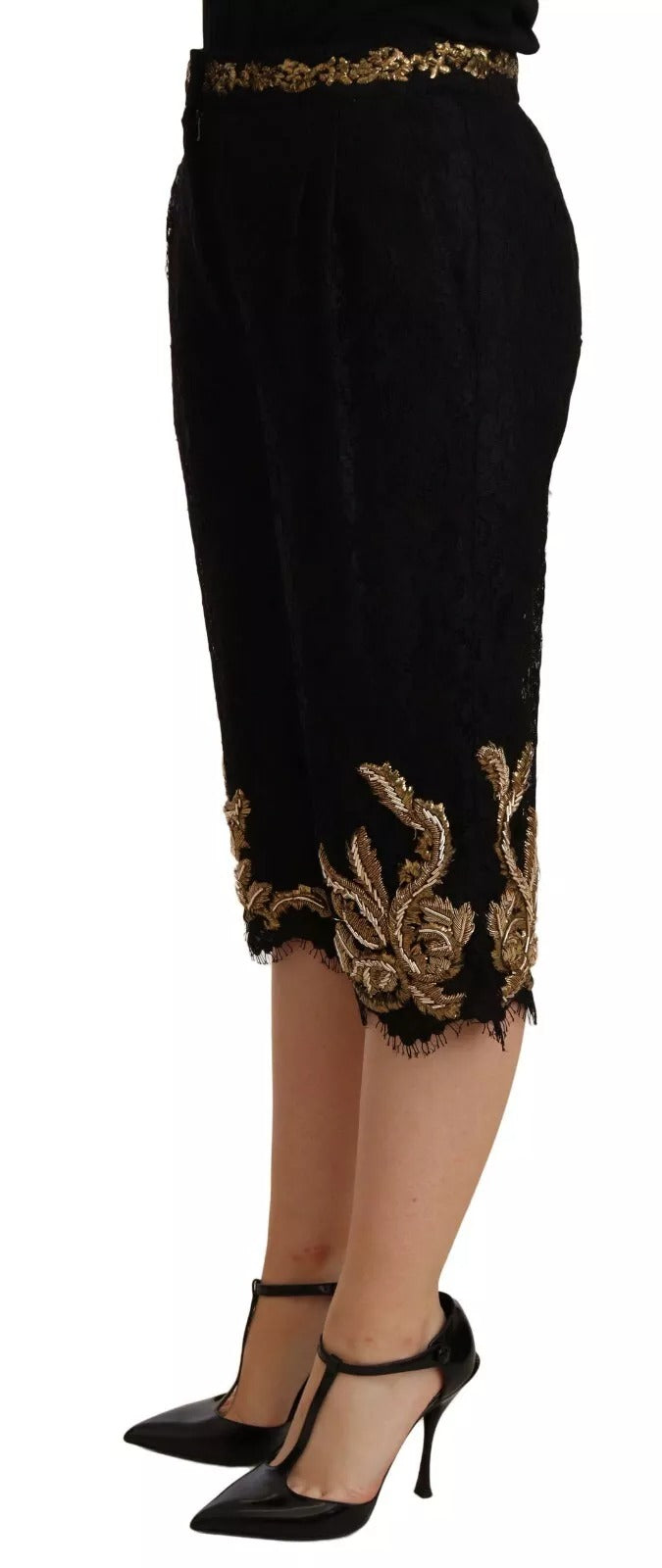 A pair of black lace shorts with gold baroque design, worn by a mannequin